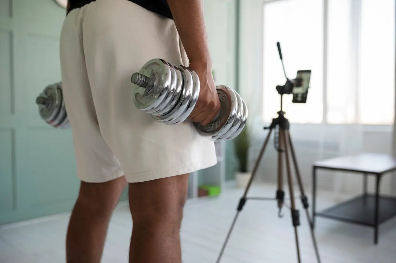 Close-up of hands holding dumbbells